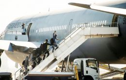 Their dreams broken, Haitians go back to their island aboard a Chilean Air Force B-767.