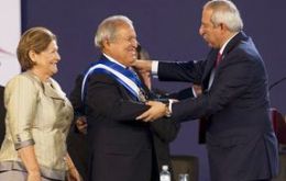 The presidential sash was presented to Sanchez Ceren by the head of the National Assembly, Sigfrido Reyes