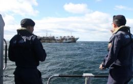 A Chilean navy officer shows the trajectory of some of the Chinese jiggers as they move along the Pacific coast     