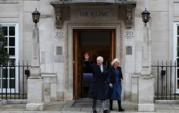 The King left the clinic in the afternoon with his wife, Queen Camilla, and waved to the cameras before getting into his car.