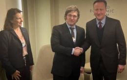 Diana Mondino and Javier Milei with David Cameron in Davos.