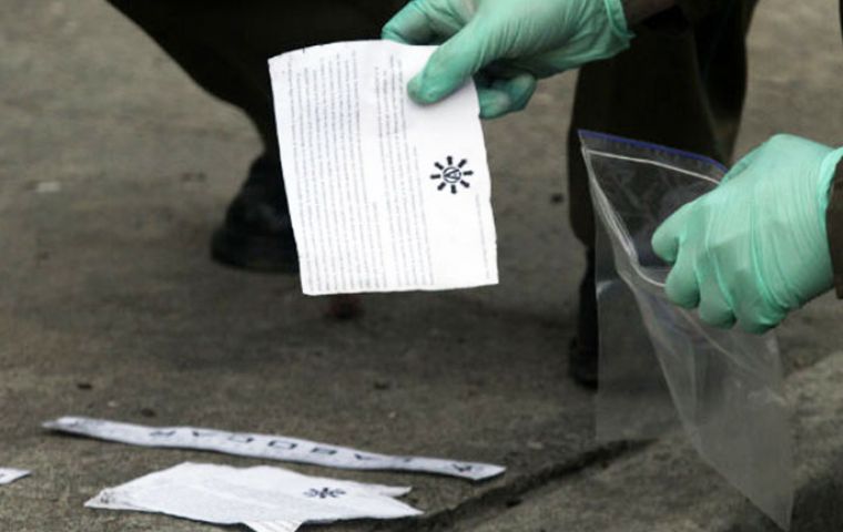  Pamphlets next to the scene of attack express support for anarchists arrested in Spain