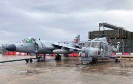 A veteran Sea Harrier and Lynx await loading onto the Falklands supply ship at Marchwood Military Port in Southampton Water. Courtesy Royal Navy