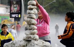 Children play with the marble sized ice (Pic AP)